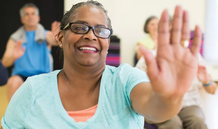 woman exercises in active adult class