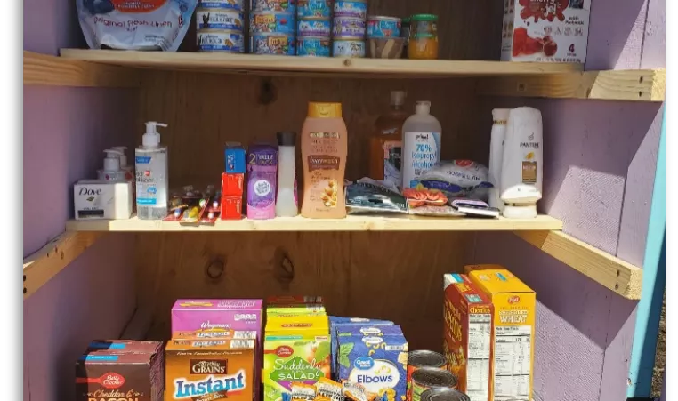 HWEAF Community Cupboard with canned goods, boxed food, hygiene products, and more.