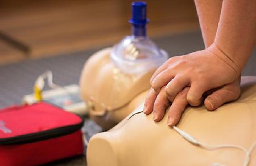 Performing CPR on a dummy